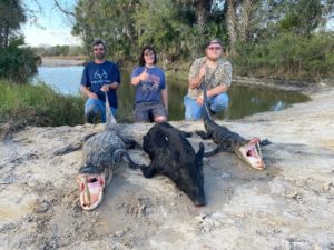 Group of friends who caught 3 alligators while hunting at our lodge.