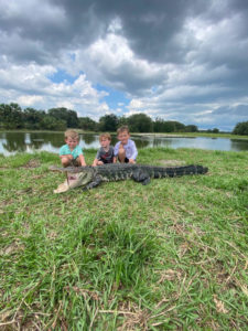 3 boys from Florida with their gator that they hunted