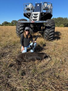 female hog hunter gets her first kill on our wild hog buggy hunt in Florida